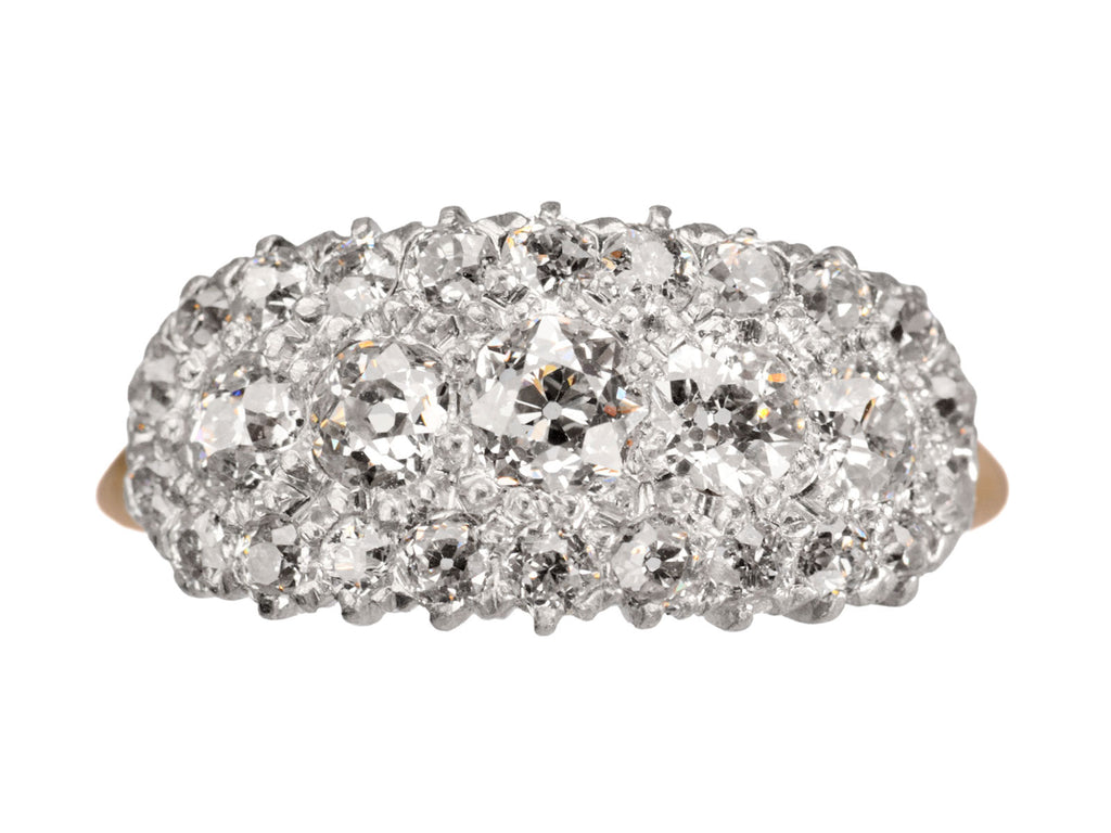Antique c1900 ring with an oval cluster of round old European cut diamonds set in platinum-topped 14K yellow gold, shown on white background.