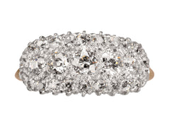 thumbnail of Antique c1900 ring with an oval cluster of round old European cut diamonds set in platinum-topped 14K yellow gold, shown on white background.