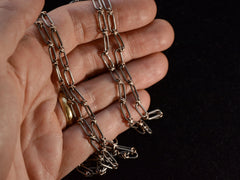 thumbnail of c1900 Long Silver and Gold Filled Chain (shown on hand for scale)