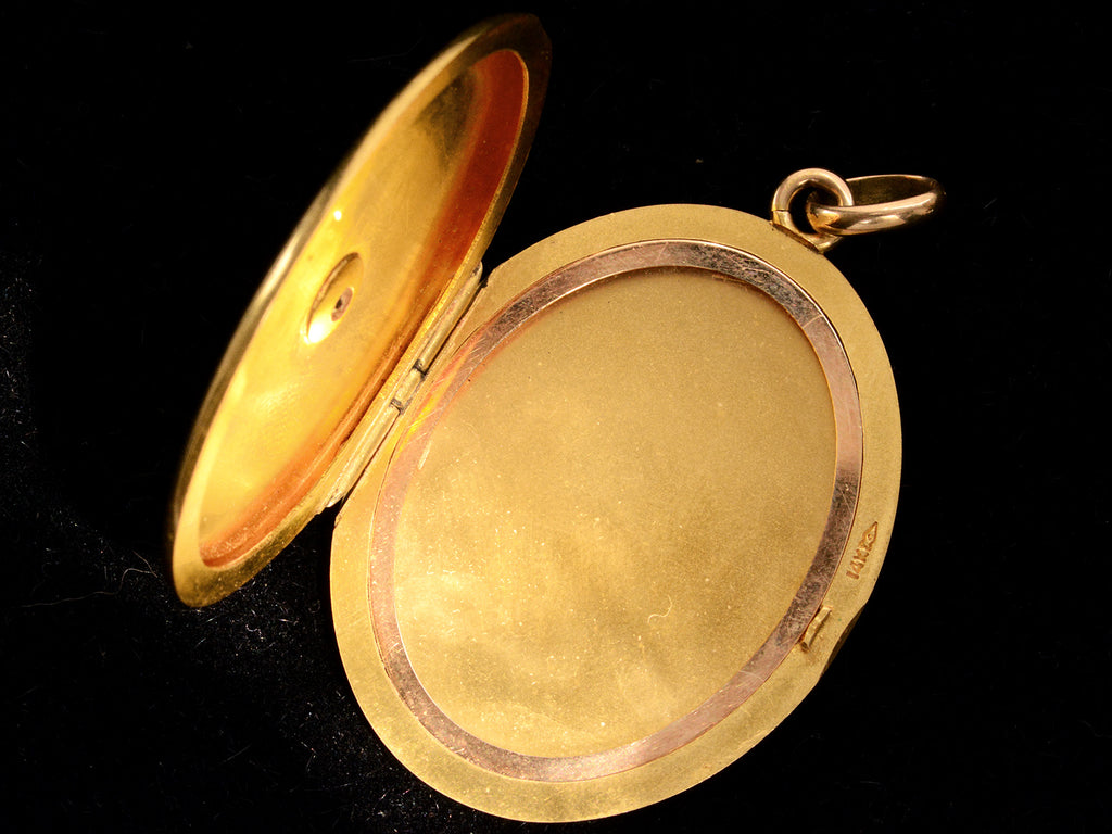 c1900 Large Oval Diamond Locket (shown open on black background)