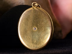 thumbnail of c1900 Large Oval Diamond Locket (on dark pink background)