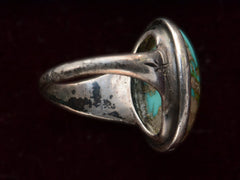 thumbnail of Inside view of c1950 Navajo Turquoise Ring in silver on black background.