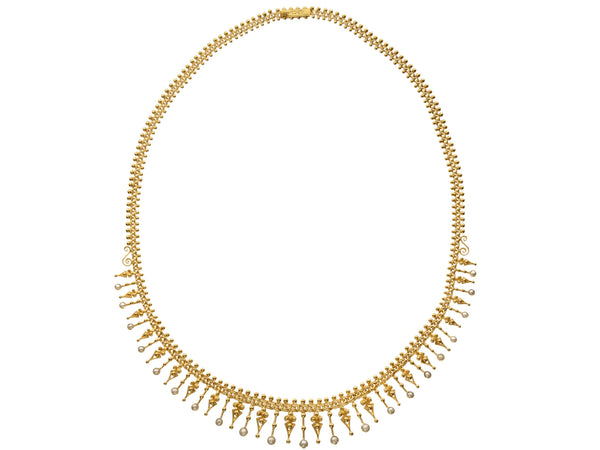 Antique c1890 yellow gold necklace with intricate detailing and a fringe of pearls , shown on white background.