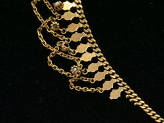 thumbnail of Backside detail view of a yellow gold c1900 Edwardian chain collar with tiny seed pearl pendants and chain swags shown on black background.
