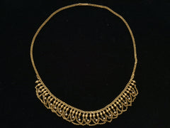 thumbnail of Full view of a yellow gold c1900 Edwardian chain collar with tiny seed pearl pendants and chain swags shown on black background.