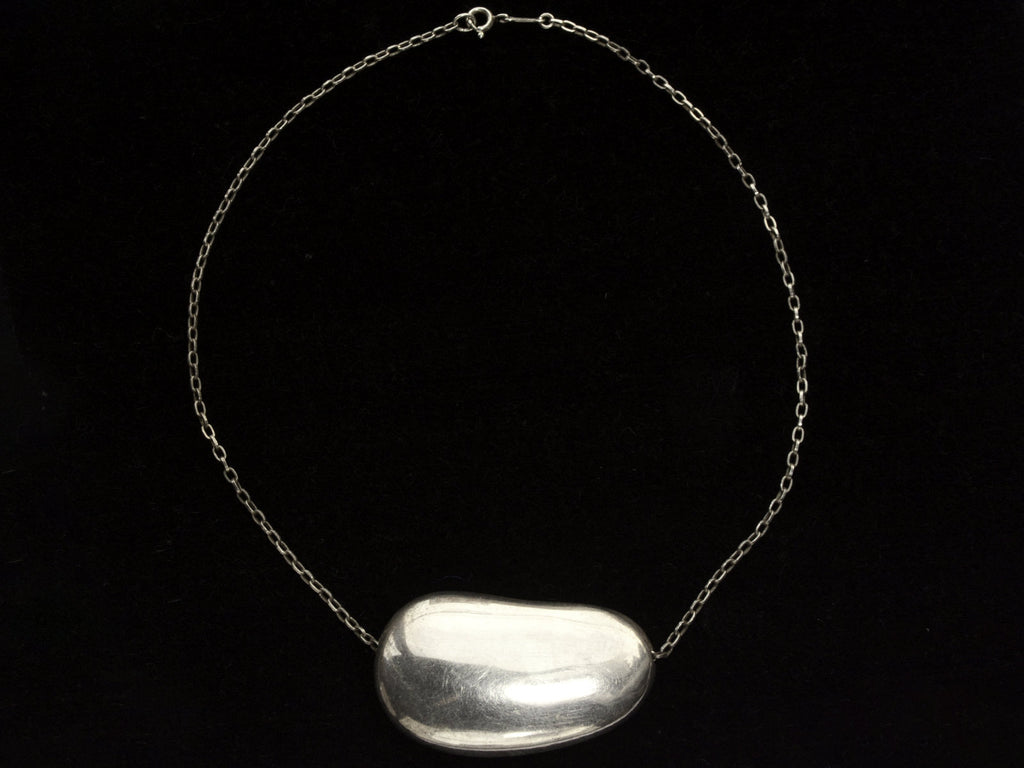 Silver c1980 Elsa Peretti Necklace with Large Bean Pendant on Chain (on black background)
