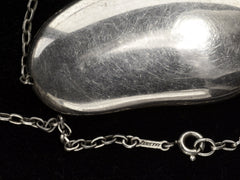 thumbnail of Detail of Silver c1980 Elsa Peretti Necklace with Large Bean Pendant on Chain (showing "Peretti" stamp on chain tag)