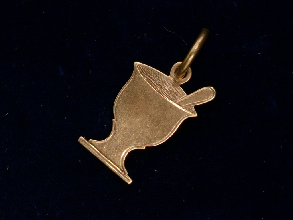 c1890 Gold Pharmacy Mortar and Pestle Charm, shown on black background