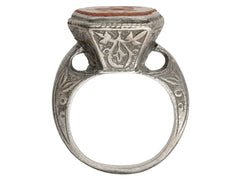 thumbnail of Side profile of 19th century Persian carnelian intaglio ring with carved detailing on silver mount (shown on white background)