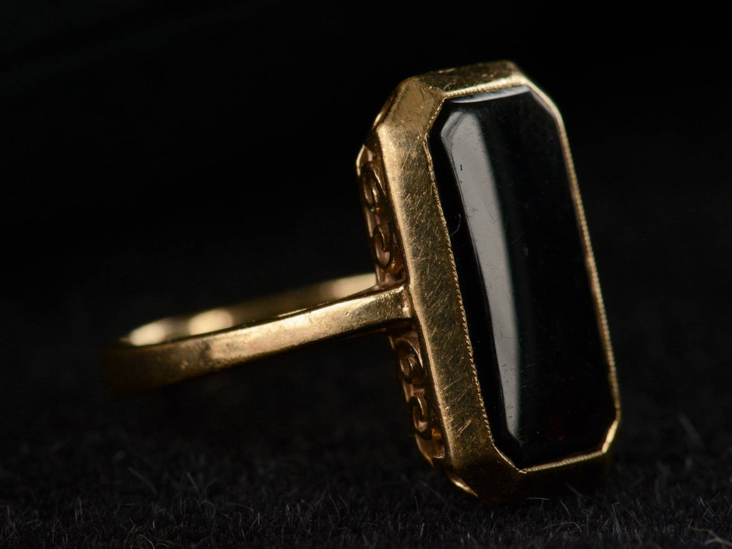 Left angle view of c1920 Rectangular Onyx and Yellow Gold Signet Ring (shown on dark background)