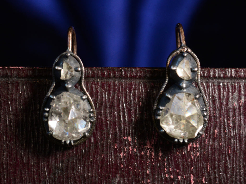 Front views of c1820 Rose Cut Diamond Earrings (on dark red and blue background)