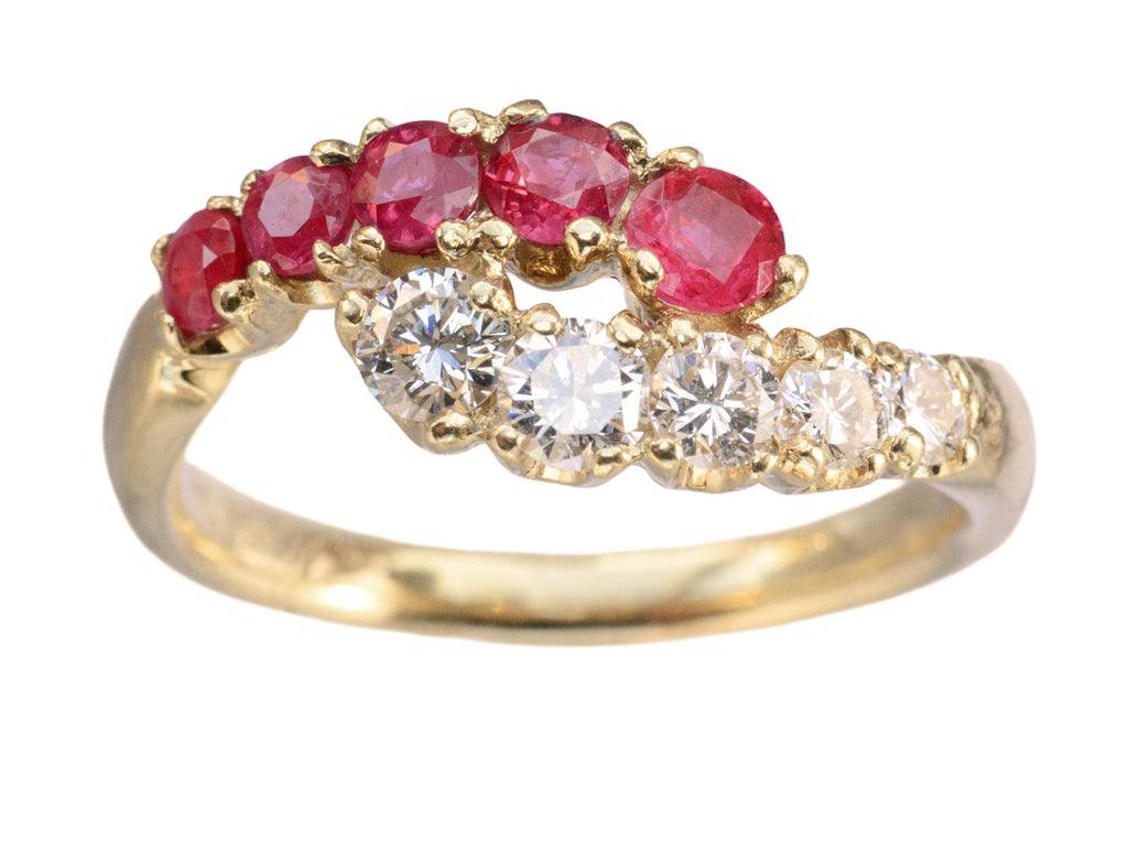 c1970 Yellow Gold Ring with rows of pink rubies and white diamonds curling around each other. On white background.
