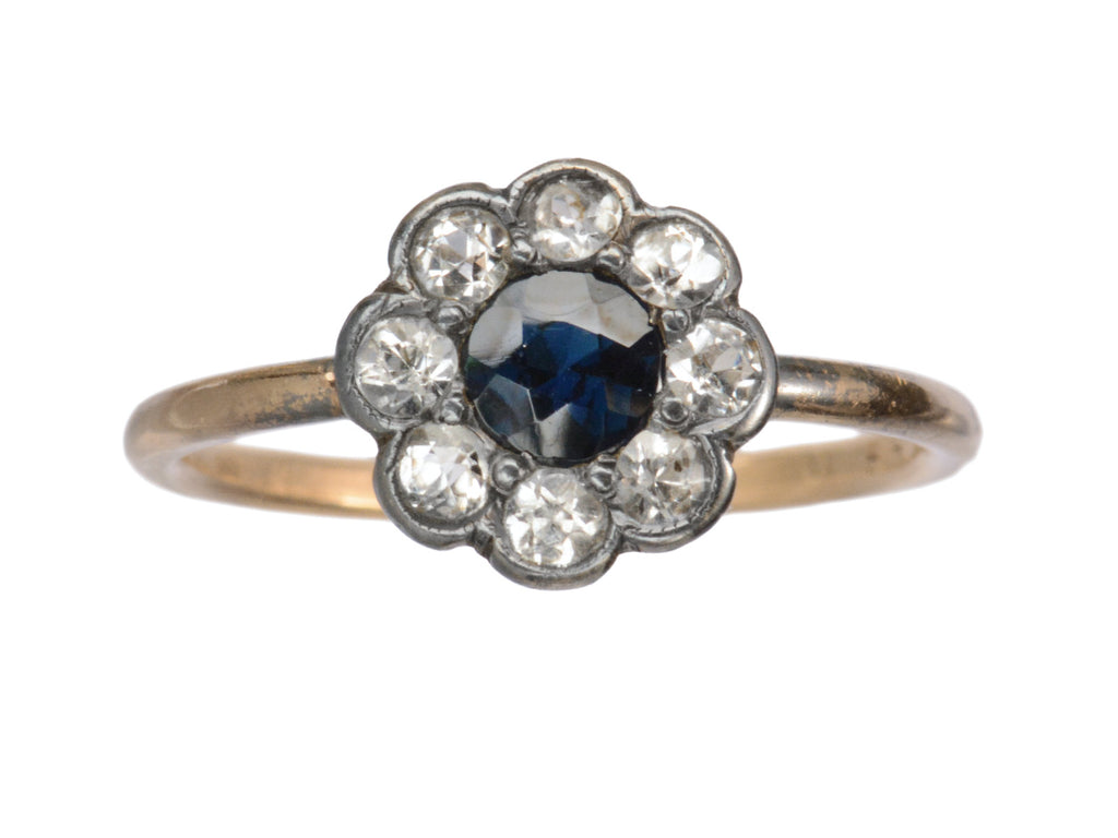 Antique silver topped gold ring with blue and white sapphires (shown on white background)