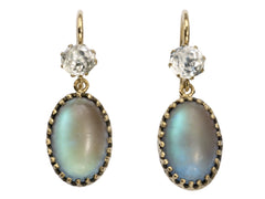 thumbnail of Pair of earrings with white crystal tops and oval pendants of pale blue glass with a reddish glow. Shown on white background.