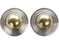 thumbnail of A pair of vintage yellow gold and silver flying saucer shaped earrings on white background.
