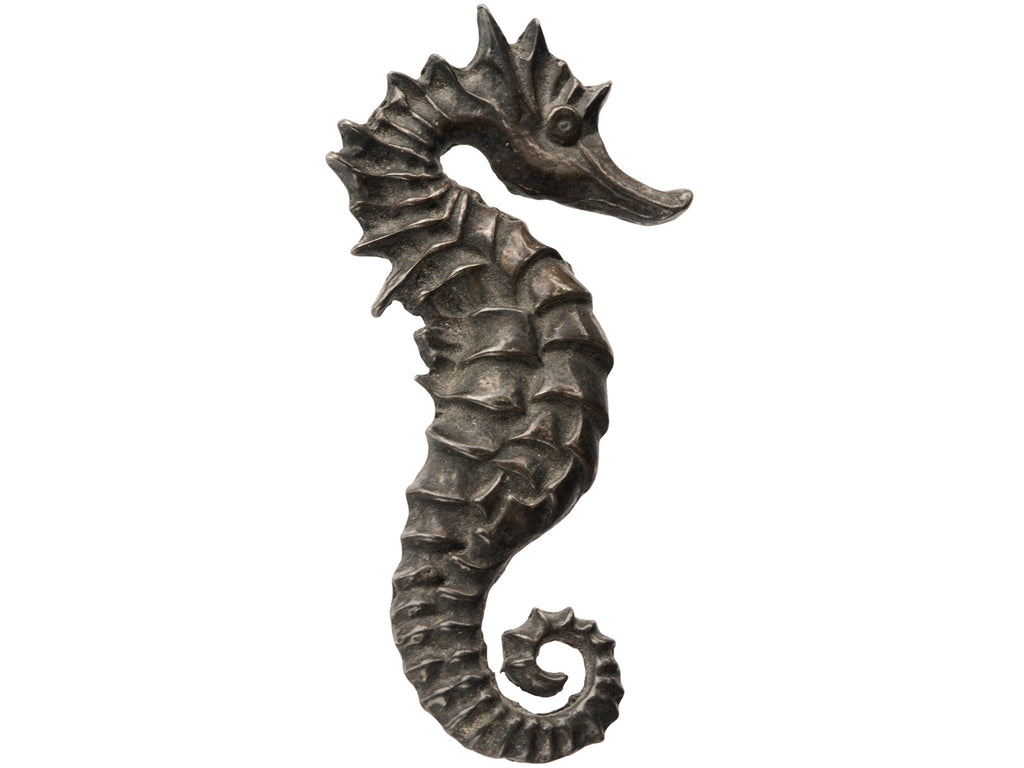 A c1970 Darkened Silver Seahorse Brooch on white background.