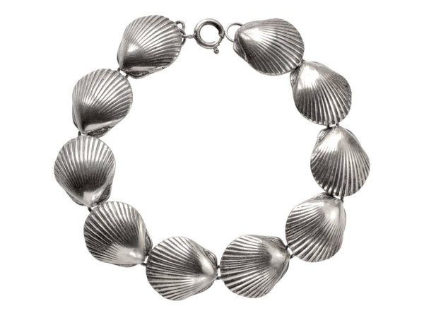 A silver bracelet with scallop shell links, on white background.