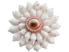thumbnail of A vintage brooch featuring white shell petals arranged in a sunburst pattern around a central peach and brown shell cabochon, set in a pinkish-beige textured border, on white background.