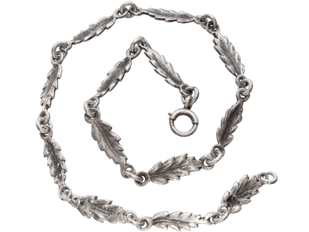 c1930 Silver Leaf Necklace (shown spiraled on white background)