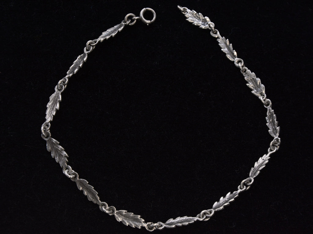 c1930 Silver Leaf Necklace (shown laid out in a circle on a black background)