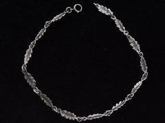 thumbnail of c1930 Silver Leaf Necklace (shown laid out in a circle on a black background)