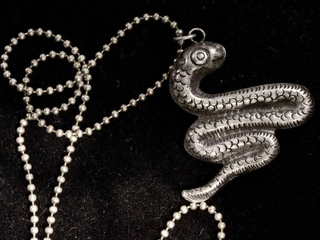 c1980 Silver Snake Necklace (reverse side on black background)