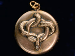 thumbnail of c1890 Rose Gold Colored Snake Locket with Diamond Head (shown on black background)