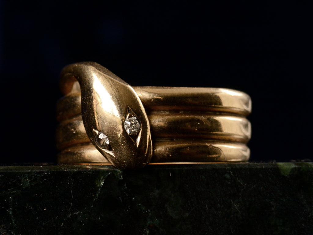 c1890 Diamond and Gold Snake Ring (left angle view on black background)