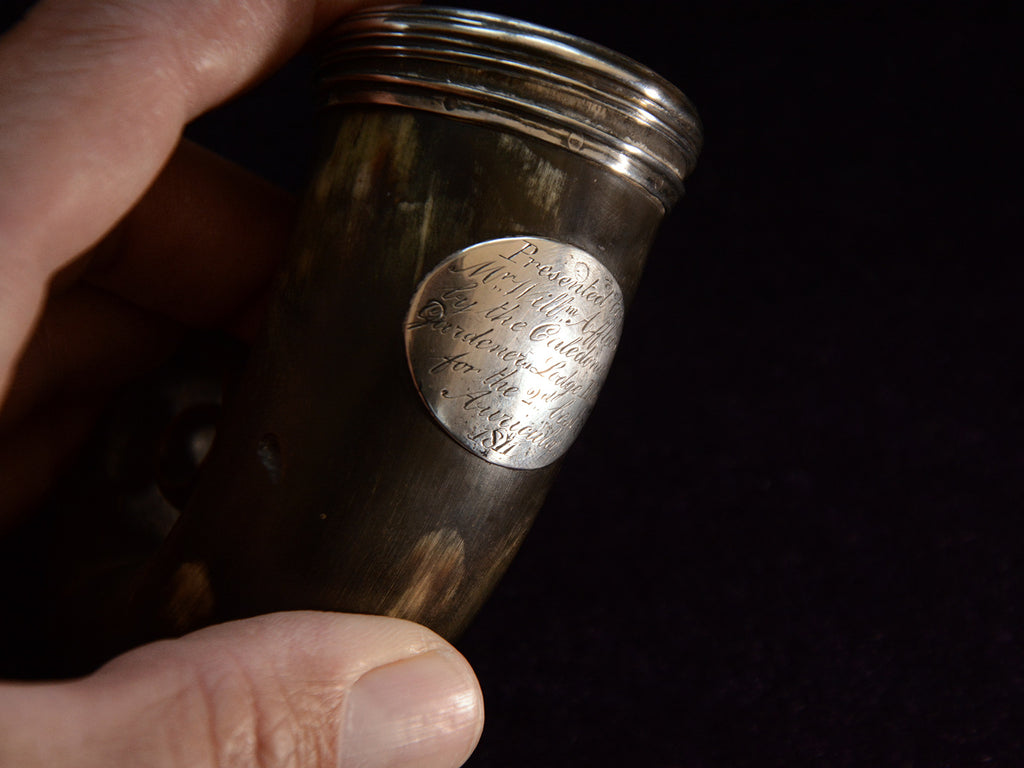 Detail view of of c1811 Dark Brown Ram's Horn Snuff Box (showing plaque that reads "Presented to Mr Will Affleck by the Caldeonian Gardeners Lodge Edin. for the 2nd best Auricula 1811"