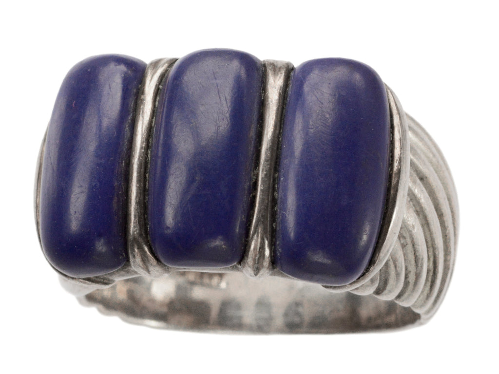 A silver ring featuring three polished dark blue resin stones, shown against a plain white background.