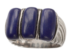 thumbnail of A silver ring featuring three polished dark blue resin stones, shown against a plain white background.