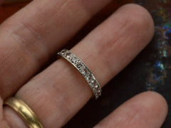 thumbnail of c1920 Gold and Platinum Eternity Band Set with White Spinels shown on finger
