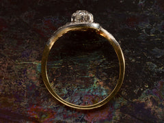 thumbnail of Side profile of antique Art Nouveau spiral form with diamonds in platinum-topped gold, shown on dark background.