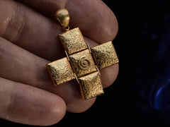 thumbnail of c1970 Spiral Cross Pendant (on hand scale)