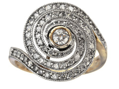 thumbnail of A vintage spiral form ring with diamonds in a white gold topped yellow gold mounting, shown on white background.