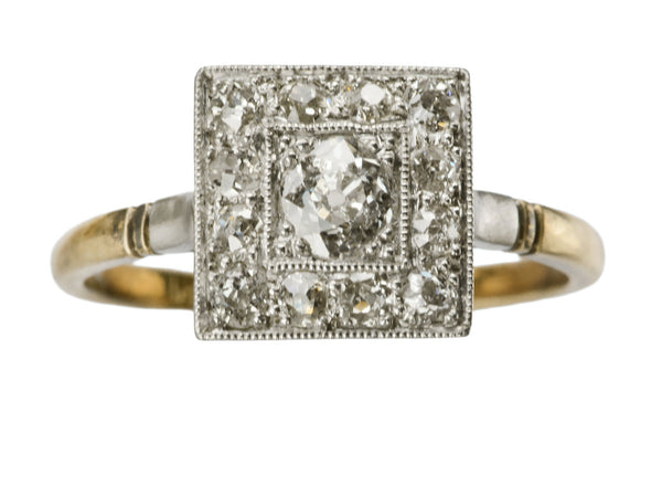 An antique platinum topped yellow gold square cluster ring with old cut diamonds, shown on white background.
