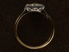 thumbnail of Side profile of antique platinum topped yellow gold square cluster ring with old cut diamonds, shown on dark textured background.