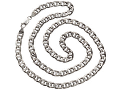 thumbnail of A c1980 silver chain with beveled, flattened curb links, shown spiraled on white background. 