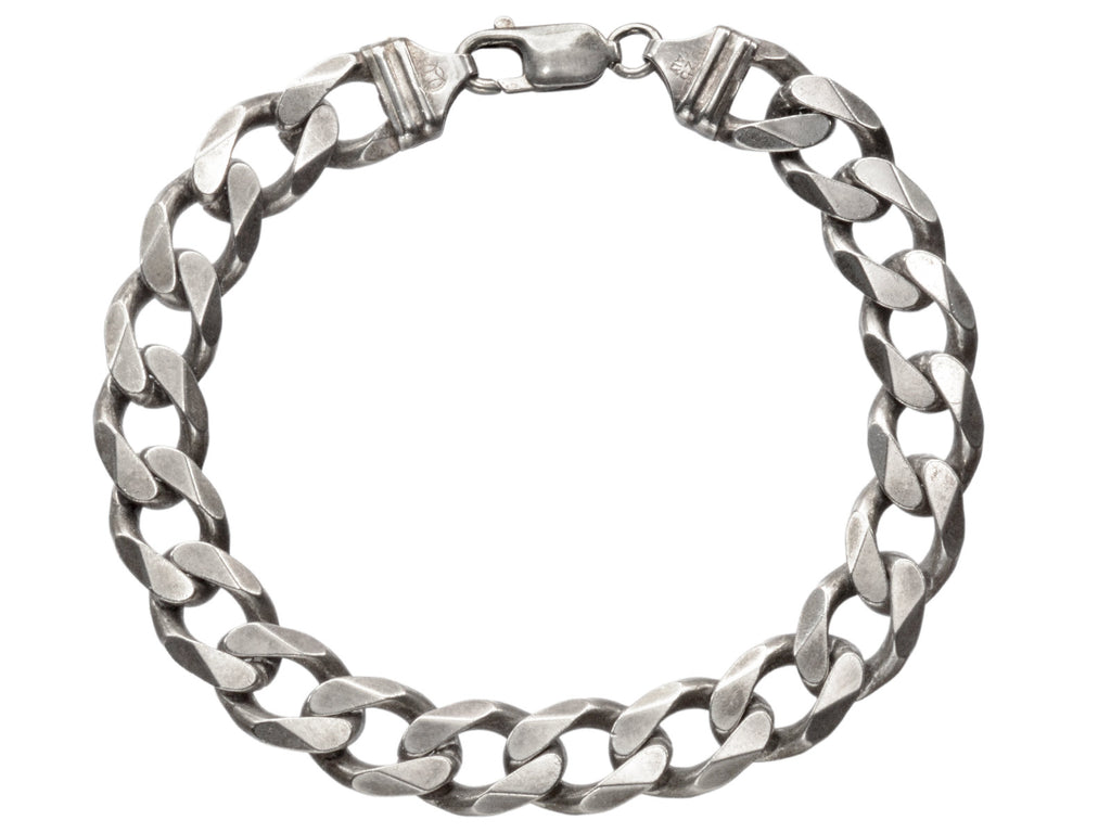 A vintage Italian sterling silver chain bracelet with beveled curb links on white background. "ITALY" and "925" stamps visible.