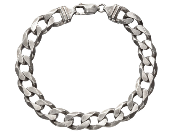 A vintage Italian sterling silver chain bracelet with beveled curb links on white background. "ITALY" and "925" stamps visible.