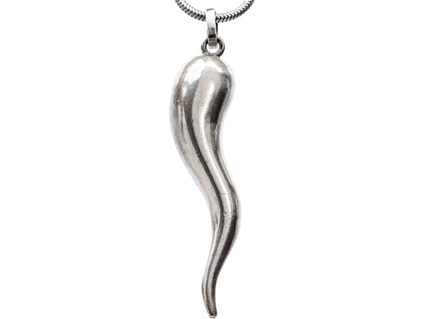 Detail of a vintage Italian silver necklace with a large cornicello horn pendant, shown on white background.