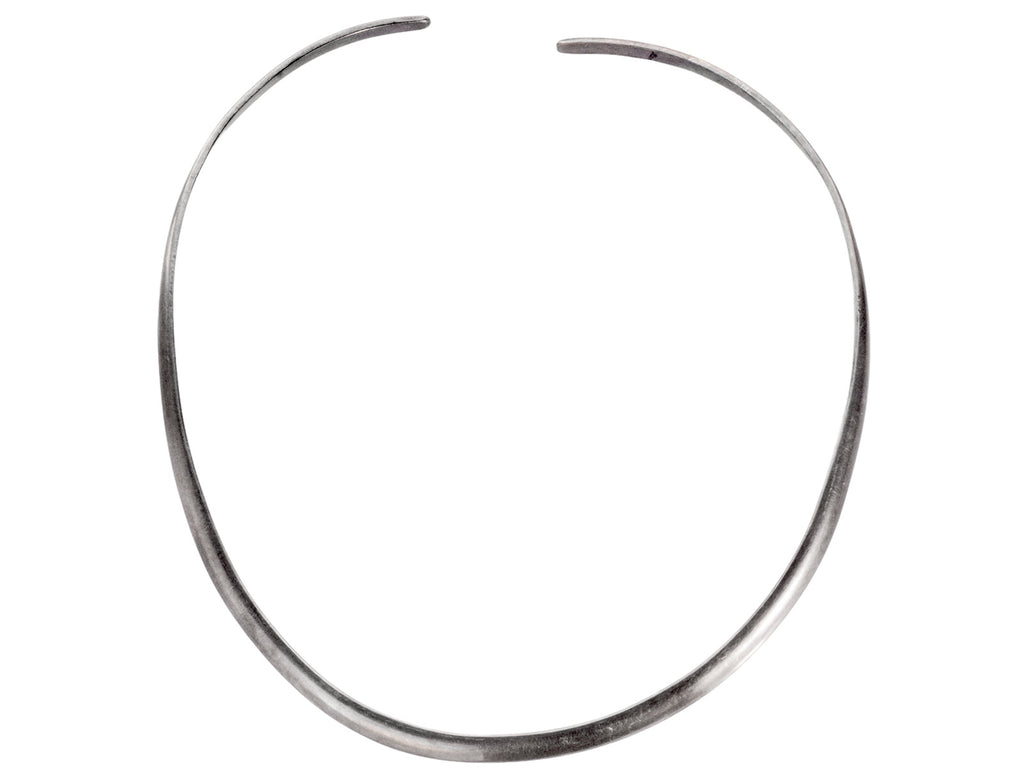 A simple silver neck cuff shown on white background.