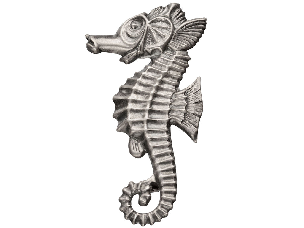 A large vintage c1950 sterling silver seahorse brooch on white background.