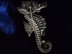 thumbnail of Reverse side of large vintage c1950 sterling silver seahorse brooch on dark background.