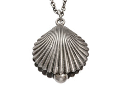 thumbnail of Antique silver shell pendant on a chain against a white background