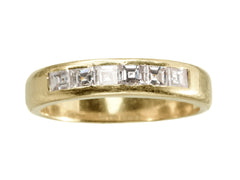 thumbnail of A vintage yellow gold band channel-set with six rectangular step cut diamonds, shown on white background