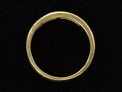 thumbnail of Side profile of a vintage yellow gold band channel-set with six rectangular step cut diamonds, shown on black background