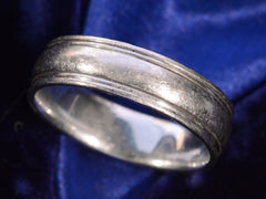 thumbnail of Angled view detail of c1980 Striped Platinum Band (on dark blue background)