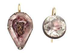thumbnail of Mismatched earrings made from pink foiled silver set buttons on gold ear wires. On white background.