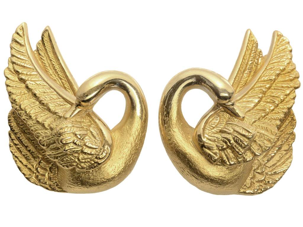 Pair of vintage swan-shaped 18K yellow gold earrings on white background.